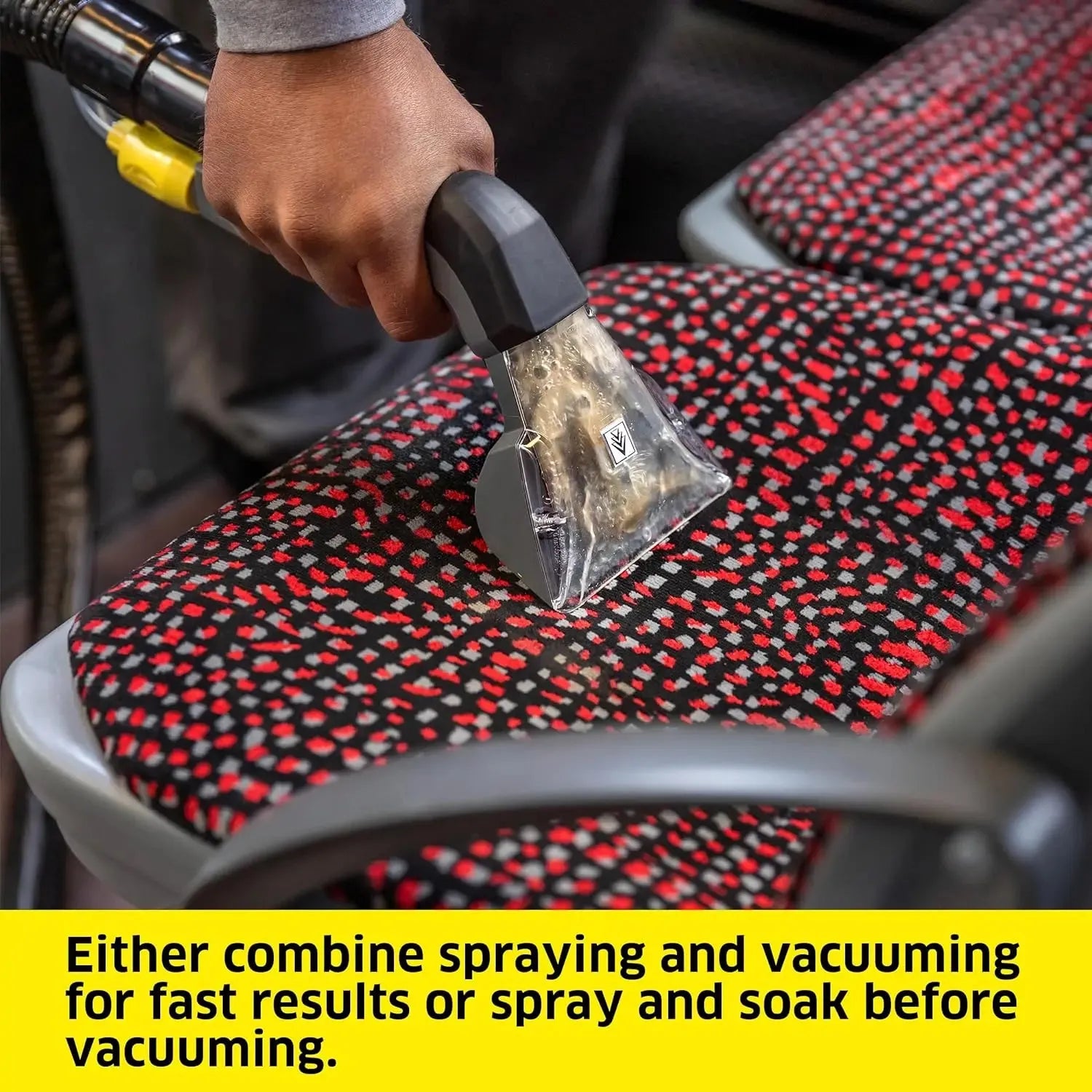 Compact carpet extractor cleaning fabric seats in a minivan