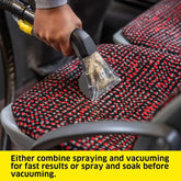 Compact carpet extractor cleaning fabric seats in a minivan