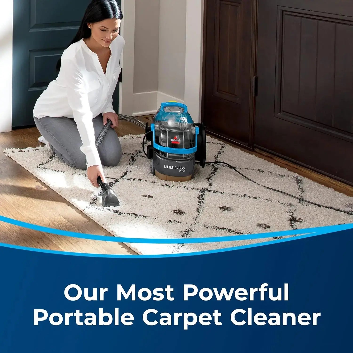 User deep cleaning a living room carpet with the Green Pro Portable Cleaner