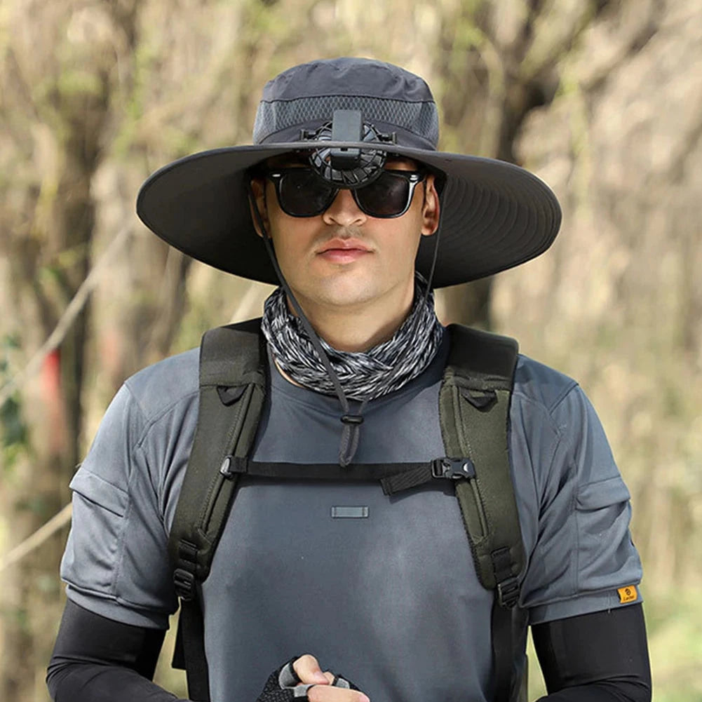 Black dual-fan cooling hat keeping wearer cool during outdoor sports