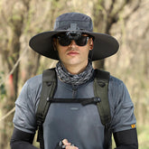Black dual-fan cooling hat keeping wearer cool during outdoor sports