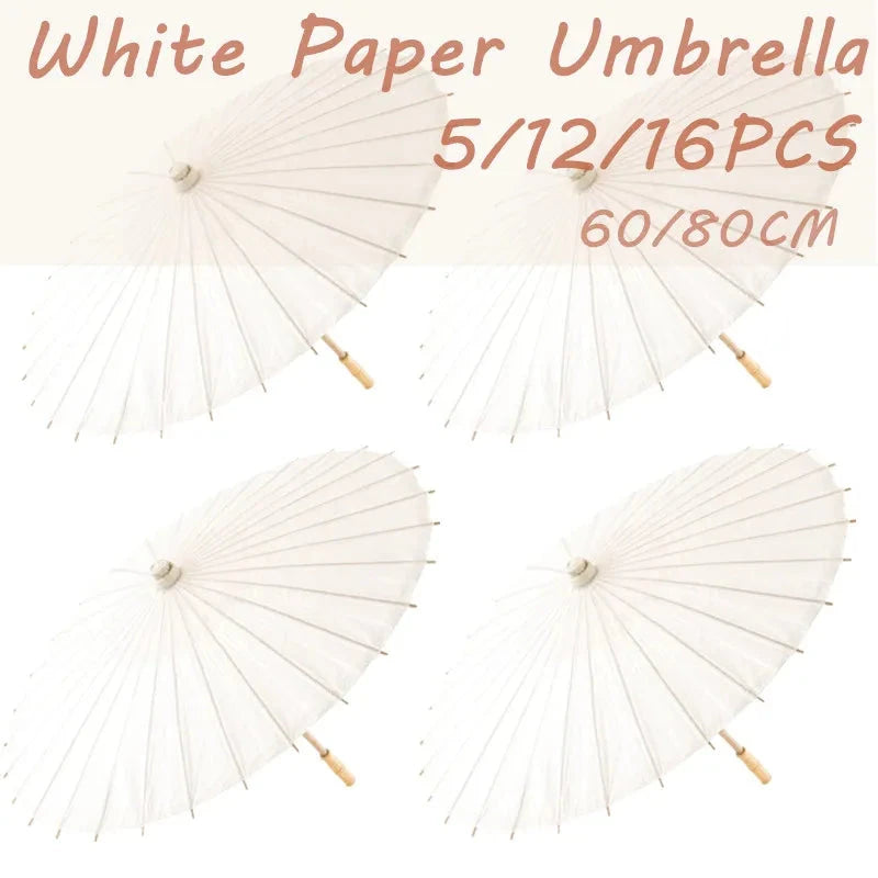 Set of paper umbrella party favors displayed on a white background