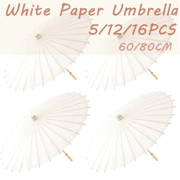 Set of paper umbrella party favors displayed on a white background
