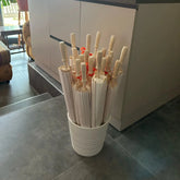 Handcrafted paper party umbrella with tropical pattern on bamboo stick