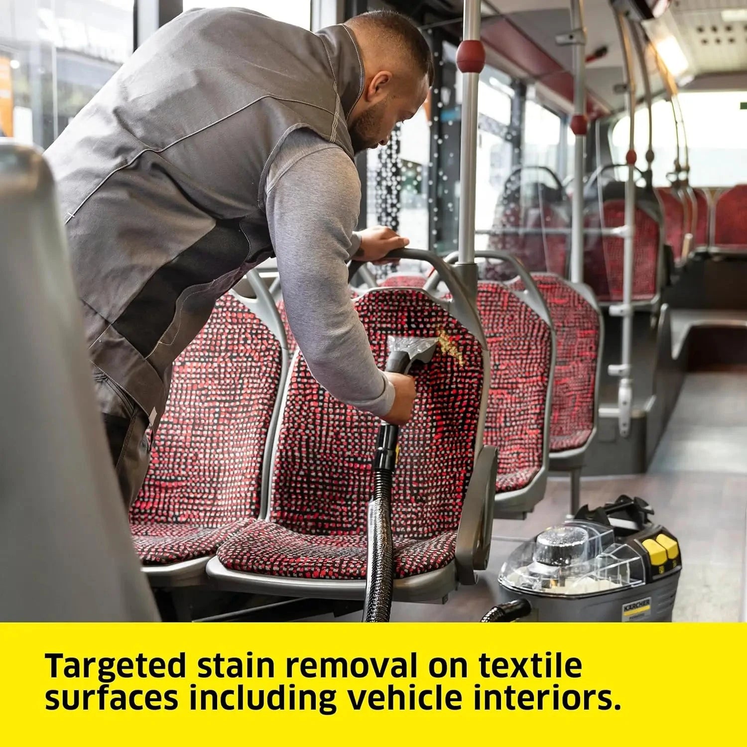 Compact carpet extractor cleaning fabric seats in a minivan