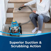 User targeting hard-to-reach corners on stair edges using Green Pro upholstery nozzle